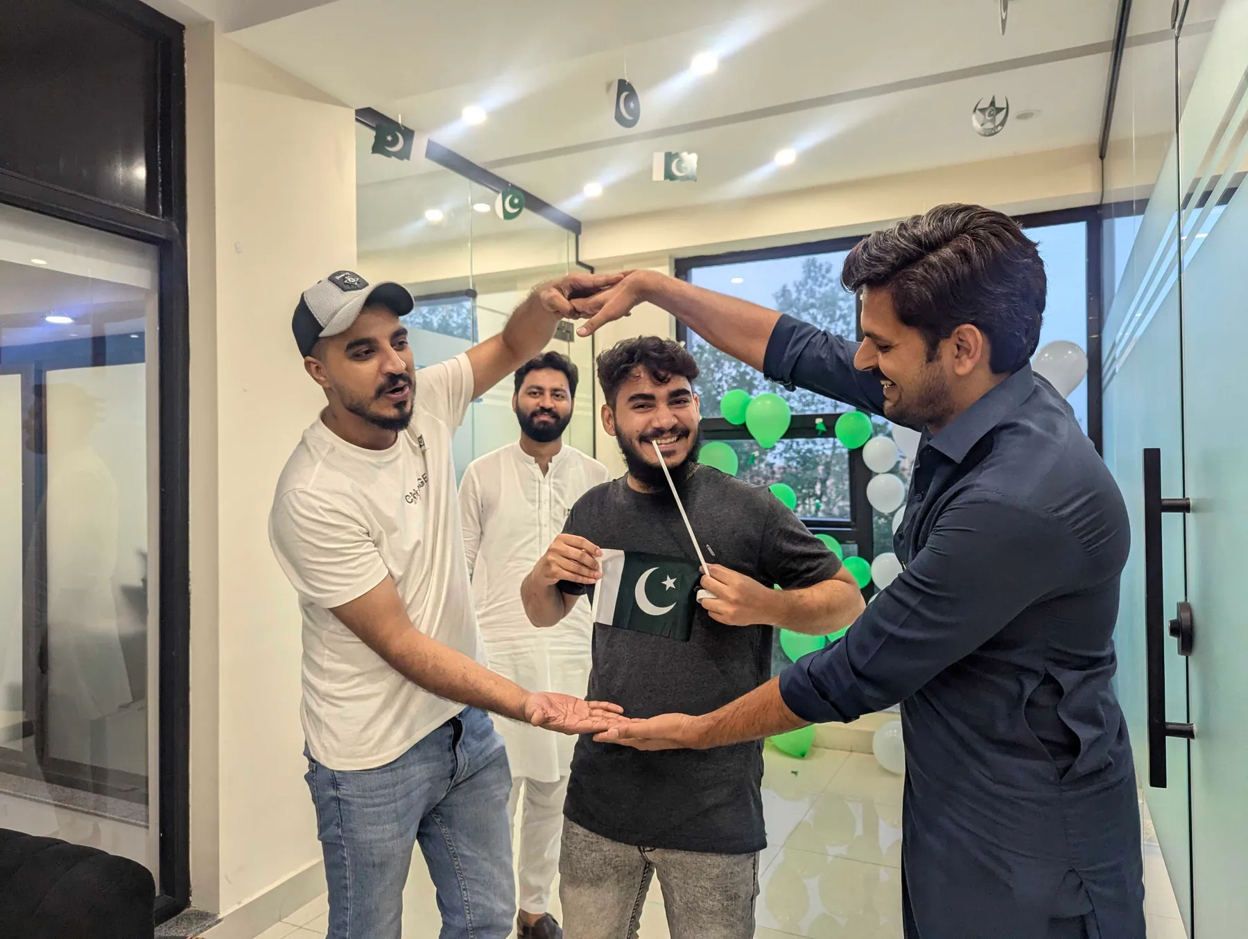 Stack Pinnacle colleagues sharing a candid moment during an office Independence Day gathering